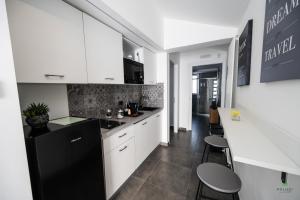 Kuchyň nebo kuchyňský kout v ubytování New River Hotel