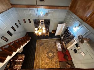 an overhead view of a staircase in a building with a rug at The Forest Way Loft by YEMBERZAL in Srinagar