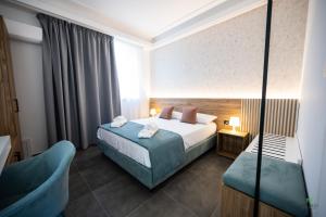 Postel nebo postele na pokoji v ubytování New River Hotel