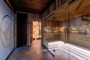 a hallway with a display case in a building at Hotel Litworowy Staw in Białka Tatrzanska