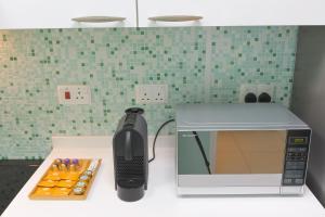 A cozinha ou kitchenette de CozyCorner - Gym & Pool Access - Reem Island