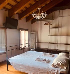 En eller flere senger på et rom på Benvenuti in Casa Peluca!