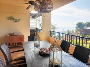 a table with a plate of food on a balcony at Isla de Altea Beach Luxury House in Altea