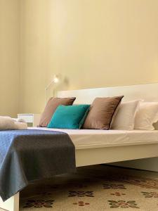 A bed or beds in a room at Palazzo Polini Apartments