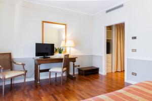 TV a/nebo společenská místnost v ubytování Hotel Tuder