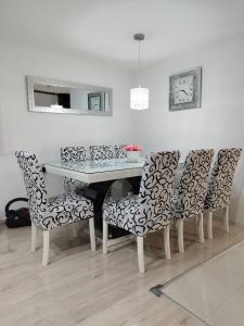 a dining room with a table and chairs at Lamia in Osijek