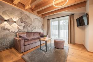 TV a/nebo společenská místnost v ubytování Biohotel Leutascherhof
