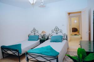 Postel nebo postele na pokoji v ubytování Tunis Oasis 4 Bedrooms private villa with private pool