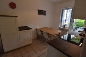 a kitchen with a table and a counter top at Ferienwohnung Hohenlimburg in Hagen +5 photos