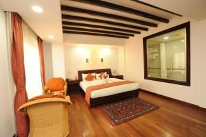 Ένα ή περισσότερα κρεβάτια σε δωμάτιο στο Apsara Boutique Hotel