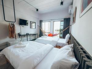 Postel nebo postele na pokoji v ubytování Haus Sathorn 11 Residence