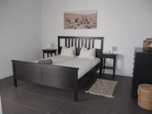a bedroom with a bed and two side tables at Sunset Apartment at Casilla de Costa in Villaverde +34 photos