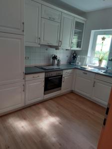 Kuchyň nebo kuchyňský kout v ubytování Ferienwohnung Mülli