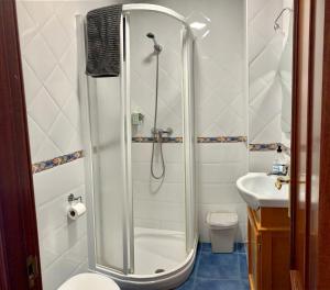 a bathroom with a shower and a toilet and a sink at Habitación González in Málaga +34 photos