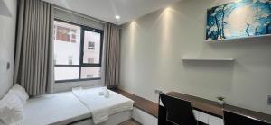 a room with a bed and a window at 30% promotion for Gold view apartment in the center of District 4, Ho Chi Minh, Vietnam in Ho Chi Minh City