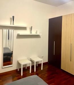 Ένα ή περισσότερα κρεβάτια σε δωμάτιο στο White Home Forli Centro