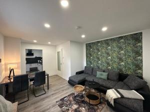 a living room with a couch and a table at HT Appartement No.3 in Greppin