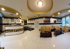 a lobby with a reception desk in a building at Al Khaleej Plaza Furnished Apartments LLC in Ajman 