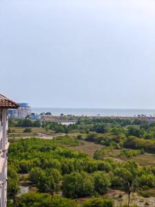 a view of the ocean from a building at Homestay Melaka Mahkota Melaya Raya in Melaka