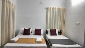 Guestland Homestay客房内的一张或多张床位