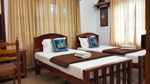 Guestland Homestay客房内的一张或多张床位