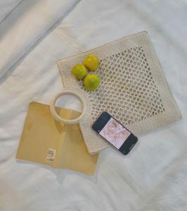 a table with a bag and some fruit on it at Beds Friends Phi Phi Hostel in Phi Phi Islands