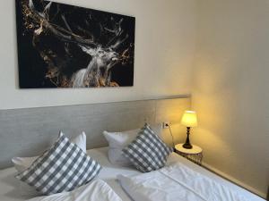 Postel nebo postele na pokoji v ubytování Harzhotel Warnstedter Krug