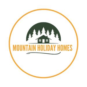 a logo for mountain holiday homes at Mountain Holiday Homes - Ottsjö, Trillevallen -Sweden in Åre
