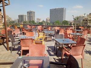 a row of tables and chairs on a patio at St.George in Cairo