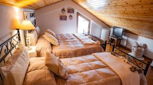 Krevet ili kreveti u jedinici u objektu Chalet Minoù Mountain Retreat