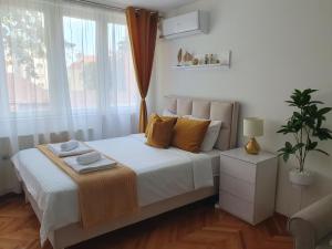 Ліжко або ліжка в номері Stan na dan Golden apartman