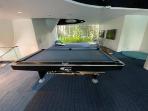 a pool table in the middle of a room at Ma Roberta @ Tambuli Resort with fast WIFI in Maribago