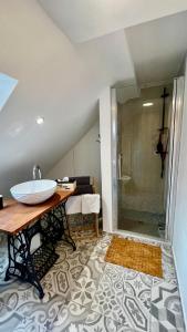 a bathroom with a sink and a shower at Apartmán Franko in Banská Štiavnica
