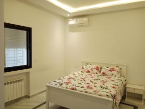 Letto o letti in una camera di DarNejib, Cité El Wafa Hammamet Nord