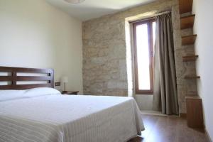 A bed or beds in a room at Camino de Rosa's