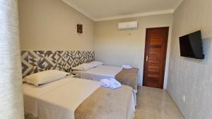 Katil atau katil-katil dalam bilik di Villa Recanto do Mar - Icaraizinho de Amontada