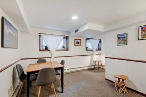 a dining room with a table and chairs at Banff Three Bedroom Basement Suite in Banff
