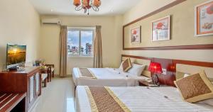 Ένα ή περισσότερα κρεβάτια σε δωμάτιο στο Sunview Beach Hotel Danang