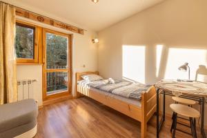 Posteľ alebo postele v izbe v ubytovaní Apartamenty i pokoje gościnne Wajdówka