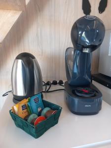 a coffee maker and a mixer on a counter at Maison de jardin 4 personnes in Montpeyroux