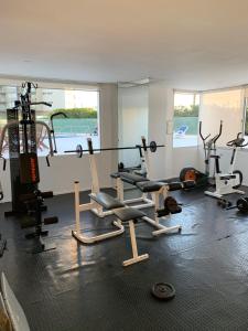 a gym with several exercise equipment in a room at Torre Marina II Punta del Este in Punta del Este