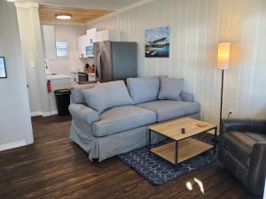 a living room with a couch and a table at Camp St. Cabanas Unit 3 on Lake Dora in Tavares