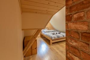 Posteľ alebo postele v izbe v ubytovaní Apartamenty i pokoje gościnne Wajdówka