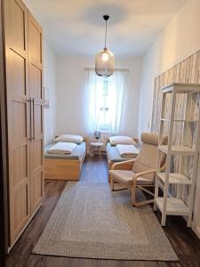 a living room with a bed and a couch at Blick zum Brückentor in Traben-Trarbach