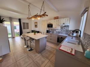 a kitchen with a table and a counter top at Casa Leone 83 in Solliès-Pont