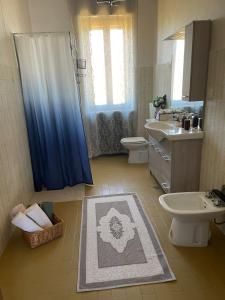 a bathroom with a shower and a toilet and a sink at Affittacamere La CRICOVA di Iulia in Cervasca +45 photos
