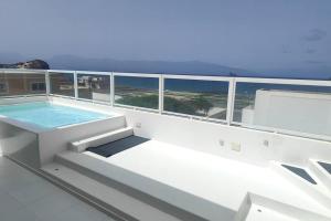 a swimming pool on top of a cruise ship at Luxury Penthouse with Private Pool, Ocean, City & Mountain view 6 Pers 2 BR in Lazareto