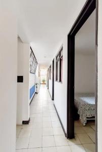 a hallway of a hospital with a room with a bed at Casa de Luz in Cali