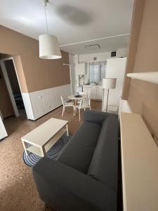 a living room with a couch and a table at La Garita Bay Apartments in La Garita