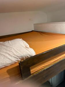 a close up of a bed in a room at Studio calme in Mitry-Mory